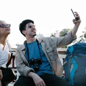 Man and Woman Taking Photos of Themselves